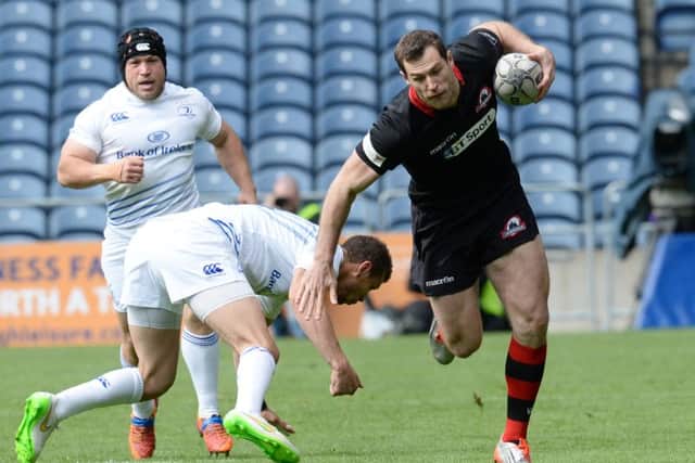 Tim Visser, in his final appearance for Edinburgh, rides a challenge at Murrayfield. Picture: SNS
