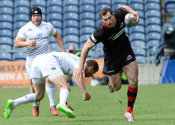Tim Visser, in his final appearance for Edinburgh, rides a challenge at Murrayfield. Picture: SNS