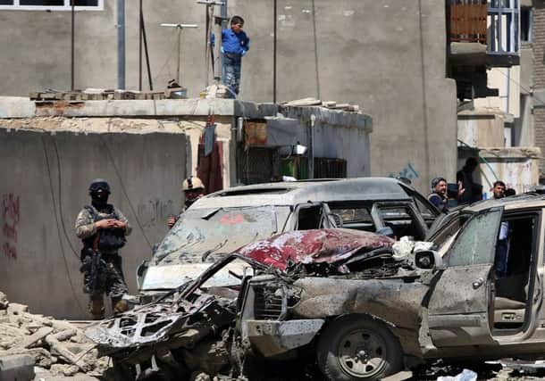 Afghan security forces inspect the site after a suicide bombing attack near Kabul's international airport. Picture: AP