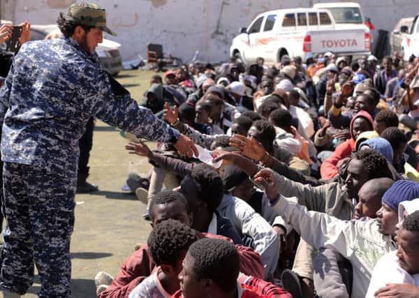 Migrants from subSaharan Africa at a detention centre in the Libyan capital, Tripoli, after being arrested en route to boarding boats headed for Europe. Picture: Getty
