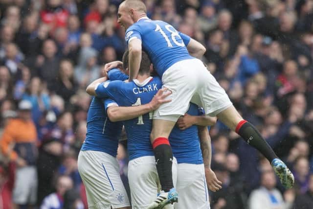 Rangers players celebrate Lee Wallace's equaliser. Picture: PA