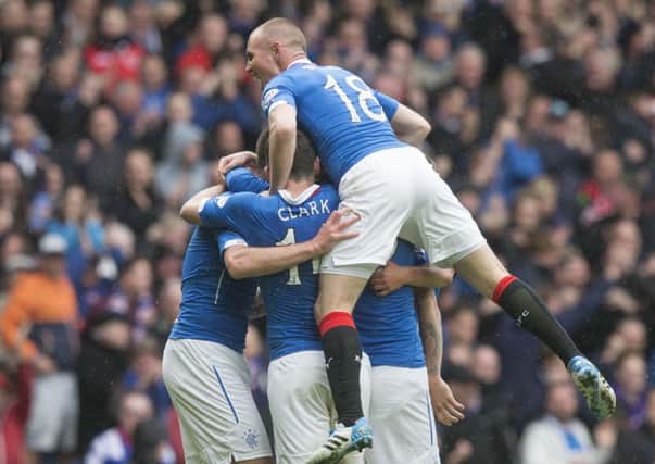Rangers players celebrate Lee Wallace's equaliser. Picture: PA
