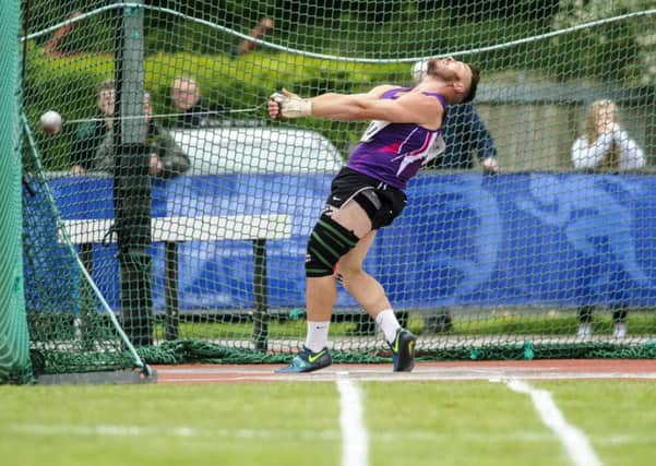 Mark Dry unleashes the throw that set a new Scottish hammer record, 79.93 metres, and also earned qualifying standard for the World Championships. Picture: Bobby Gavin