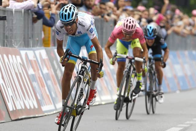 Astanas Italian rider Fabio Aru, left, leads Alberto Contador and Richie Porte across the line to reduce Contadors lead at the Giro dItalia to just three seconds. Picture: AFP/Getty