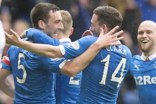 Lee Wallace celebrates with Nicky Clark. Picture: PA