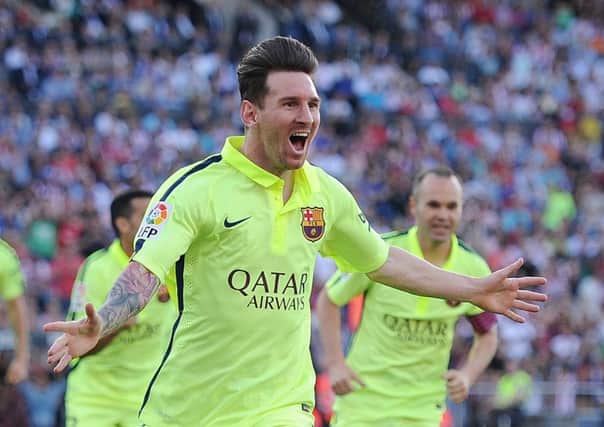 Lionel Messi celebrates after scoring Barcelona's opening goal. Picture: Getty