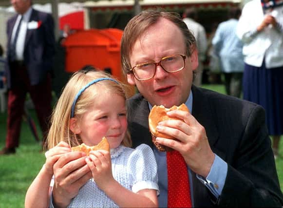 On this day in 1990 agriculture minister John Gummer fed his daughter a beef burger to try calm fears about mad cow disease. Picture: PA