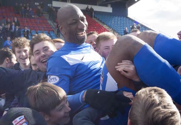 Goalscoring hero Marvin Andrews is carried off the field by jubilant Montrose fans. Picture: Paul Reid
