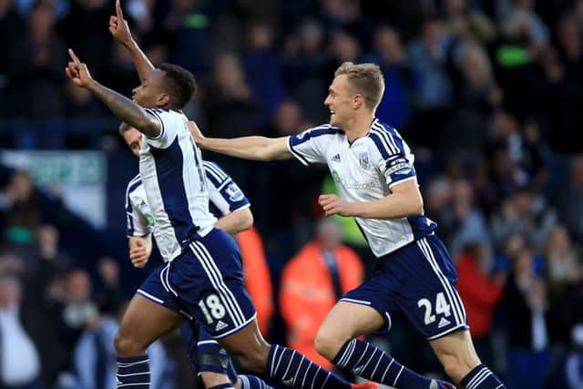 West Broms Saido Berahino, left, celebrates his first goal against Chelsea. Picture: PA