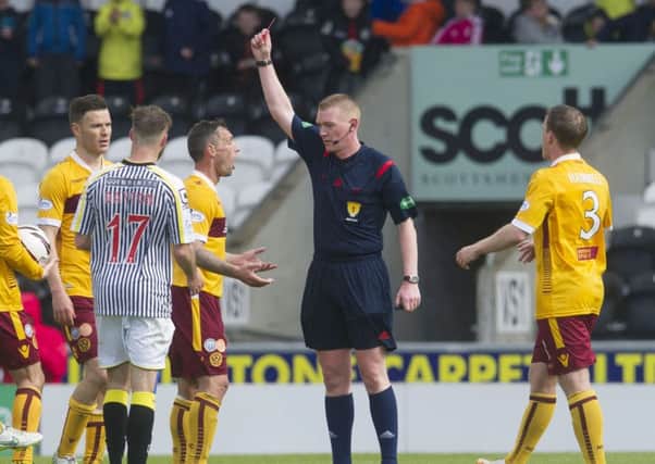 Motherwell's Scott McDonald (3rd from right) is shown the red card by referee Brian Colvin. Picture: SNS Group