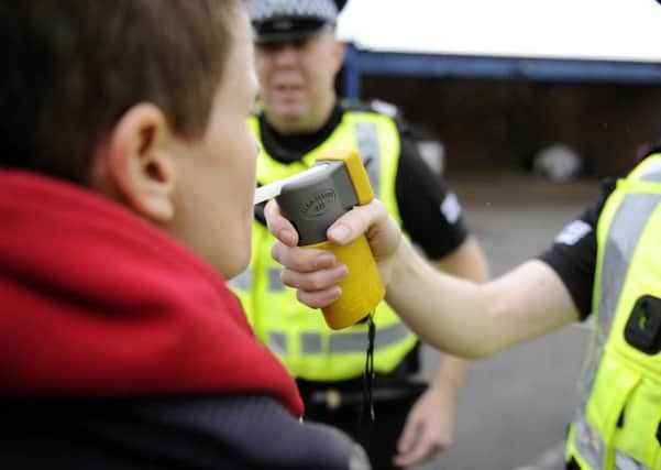 The Police Federation wants England and Wales to follow Scotland's example. Picture (posed by models): John Devlin