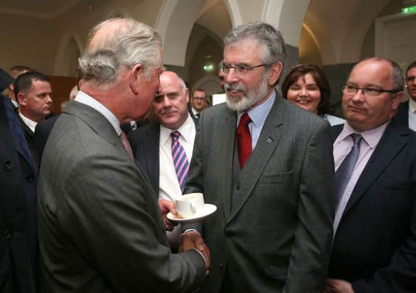 The Prince of Wales (left) shakes hands with Sinn Fein president Gerry Adams at the National University of Ireland in Galway. Picture: PA