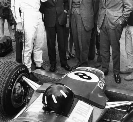 Racing driver Graham Hill discussing his car with Prince Charles, Earl Mountbatten and the Duke of Kent, at Brands Hatch, England, July 20th 1968. Picture: Getty