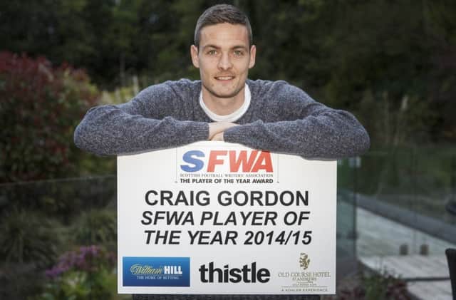 Craig Gordocelebrates winning the Player of the Year award fro the Scottish Football Writers' Association. Picture: Steve Welsh