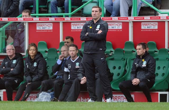 Hibs boss Alan Stubbs is calmness personified as he surveys the match against Rangers at Easter Road in March. Picture: Neil Hanna