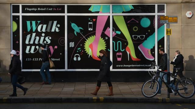 Shoppers on Princes Street, Edinburgh. High street activity is likely to remain subdued in Scotland despite the recent sunshine. Picture: TSPL