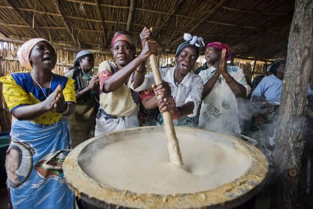 People preparing food in Africa as part of the Mary's Meals charity drive. Picture: Chris Watt