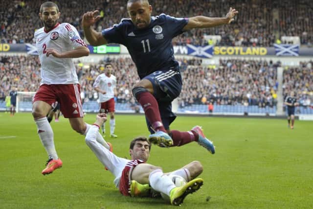 Ikechi Anya rides a tackle in Scotland's match against Georgia last October. Picture: Ian Rutherford