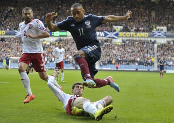 Ikechi Anya rides a tackle in Scotland's match against Georgia last October. Picture: Ian Rutherford