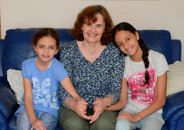 Louise Henderson and her daughters Ayisha, 9, left, and Mariam, 11. Picture: SWNS/Hemedia
