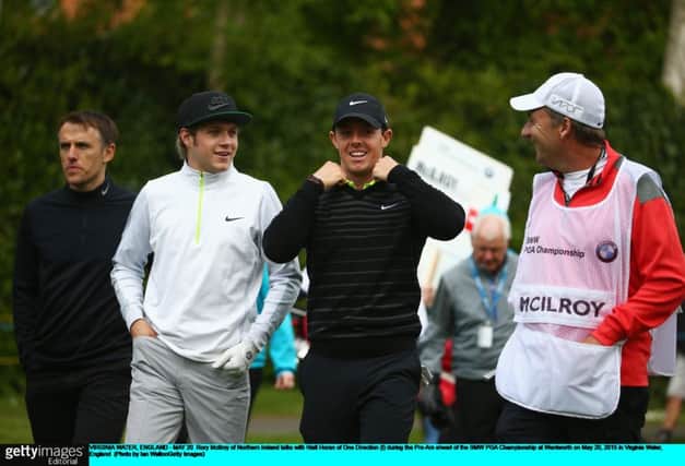 There was no shortage of celebrities on show at the pro-am yesterday, with Rory McIlroy joined by Niall Horan, second from left, a member of boyband One Direction, and Phil Neville, the former Manchester United defender, far left. Picture: Getty