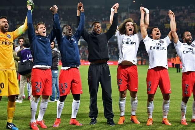 Paris Saint-Germain's players celebrate winning their third consecutive French Ligue 1 title on May 16, 2015. Picture: AFP/Getty Images