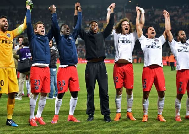 Paris Saint-Germain's players celebrate winning their third consecutive French Ligue 1 title on May 16, 2015. Picture: AFP/Getty Images