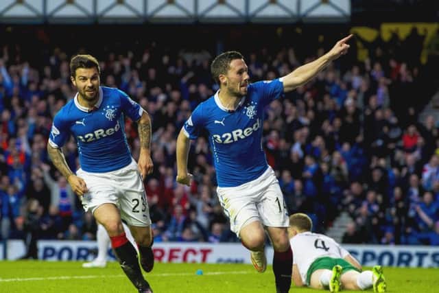 Nicky Clark wheels away to celebrate putting Rangers ahead just before half-time. Picture: SNS