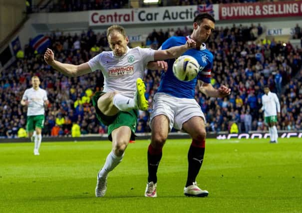 Hibernian's David Gray challenges Lee Wallace for possession. Picture: SNS