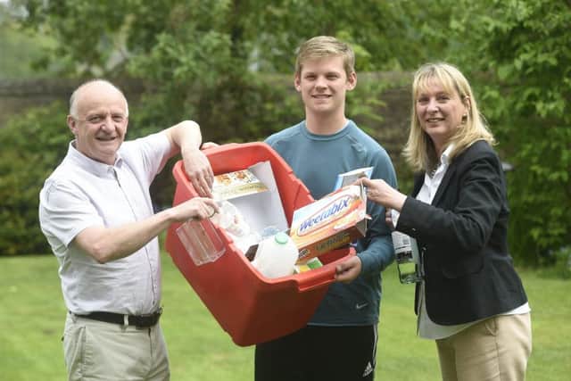 Barbara and Nick Armstrong pictured at home doing some recycling with their son Elliot. Picture: TSPL