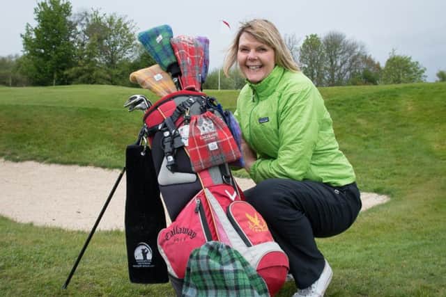 Mairead Hume, from Dunblane, with some examples of her Harris tweed golf collection club head covers, shoe bags and trolley hand warmers