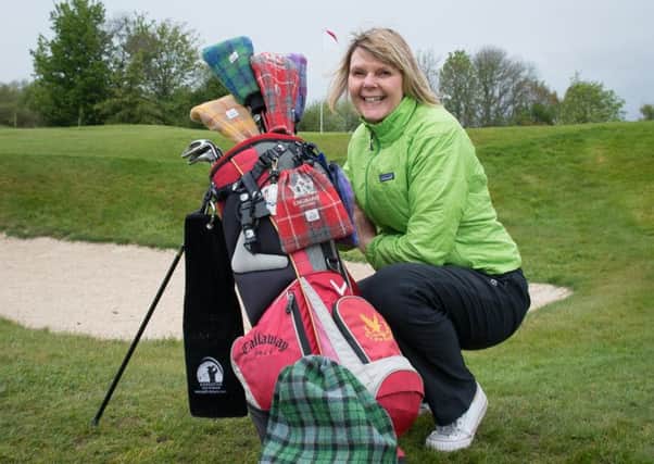 Mairead Hume, from Dunblane, with some examples of her Harris tweed golf collection club head covers, shoe bags and trolley hand warmers