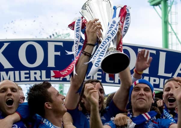 Alex Rae, Barry Ferguson and Dado Prso celebrate after being handed the title. Picture: SNS