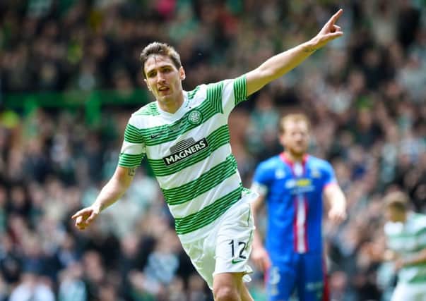 Stefan Scepovic wheels away after scoring his second and Celtic's third of the afternoon. Picture: SNS