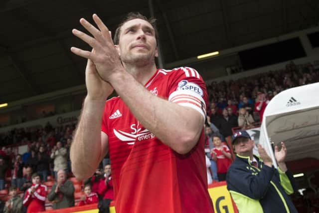 Russell Anderson applauds the Pittodrie crowd as his playing career comes to an end. Picture: SNS