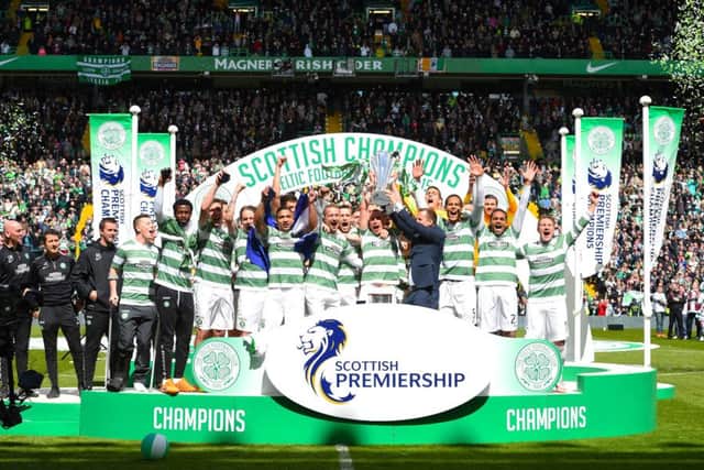 Champions: Celtic celebrate winning the Scottish Premiership 2014/15 trophy. Picture: SNS