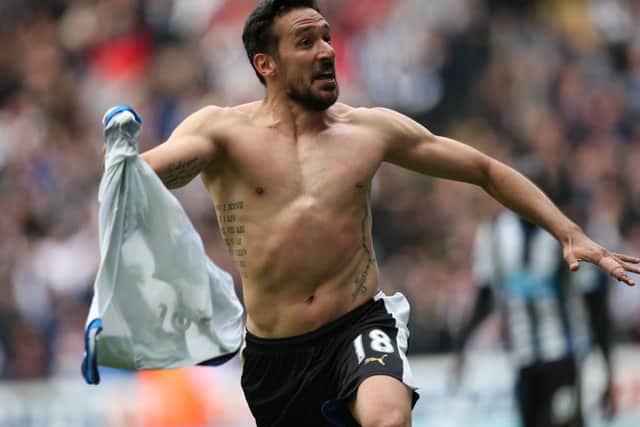 Jonas Gutierrez wheels away in delight after sealing Newcastle's victory. Picture: Getty