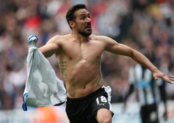 Jonas Gutierrez wheels away in delight after sealing Newcastle's victory. Picture: Getty
