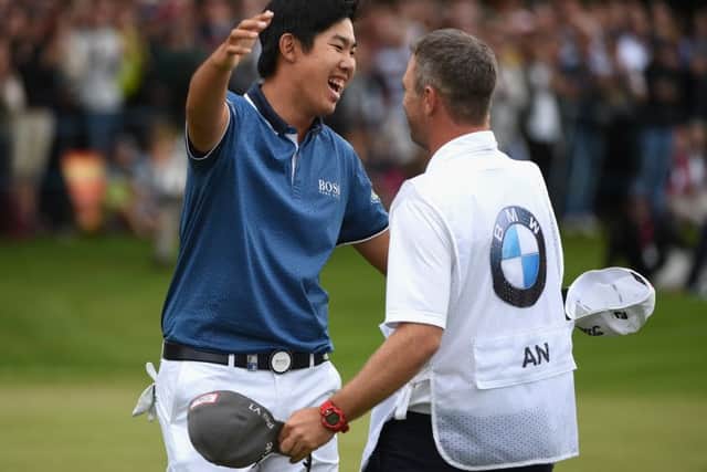Byeong-Hun An celebrates victory yesterday before lifting the PGA Championship trophy. Picture: Getty