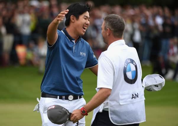 Byeong-Hun An celebrates victory yesterday before lifting the PGA Championship trophy. Picture: Getty