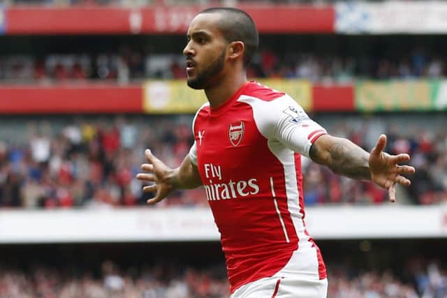 Theo Walcott celebrates opening the scoring for Arsenal. Picture: Getty