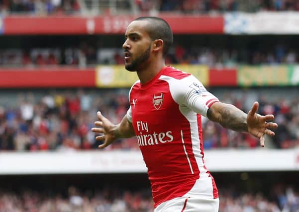 Theo Walcott celebrates opening the scoring for Arsenal. Picture: Getty