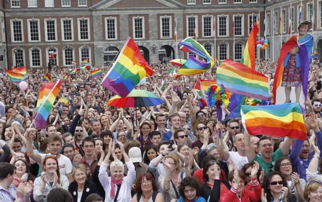 Supporters of gay marriage watch the count in Dublin on a big screen. Picture: AP