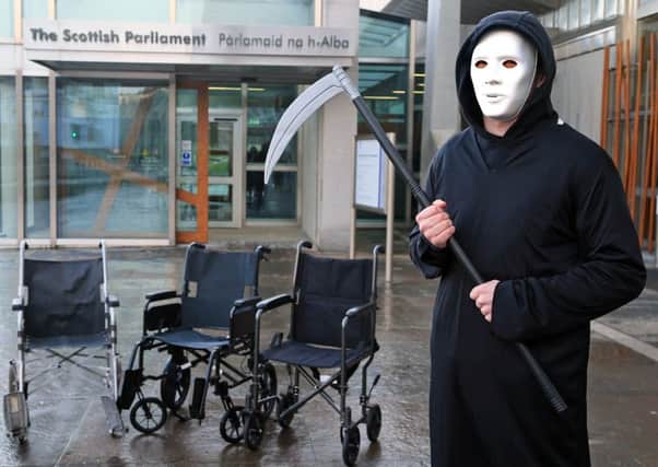 The Grim Reaperat a wheelchair protest outside the Scottish Parliament ahead of a reading of the assisted suicide legislation. Picture: Gordon Fraser