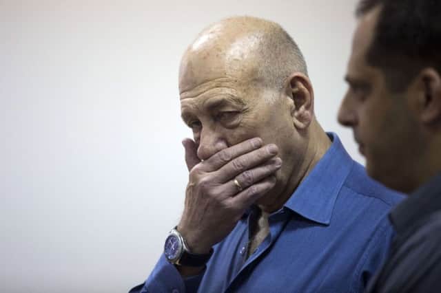 A clearly shaken Ehud Olmert has been jailed for eight months. Picture: Getty