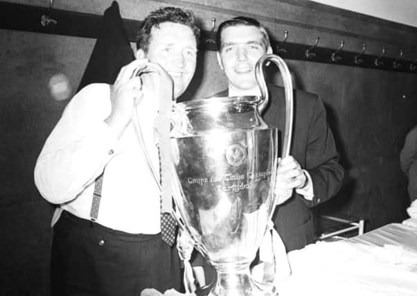 Then Celtic manager Jock Stein (left) and player Bobby Murdoch with the European Cup in the dressing room of Estadio Nacional stadium, Lisbon. Picture: AP