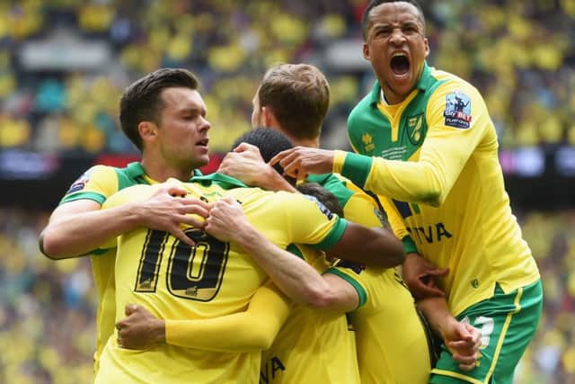 Cameron Jerome is congratulated by his team mates after opening the scoring. Picture: Getty