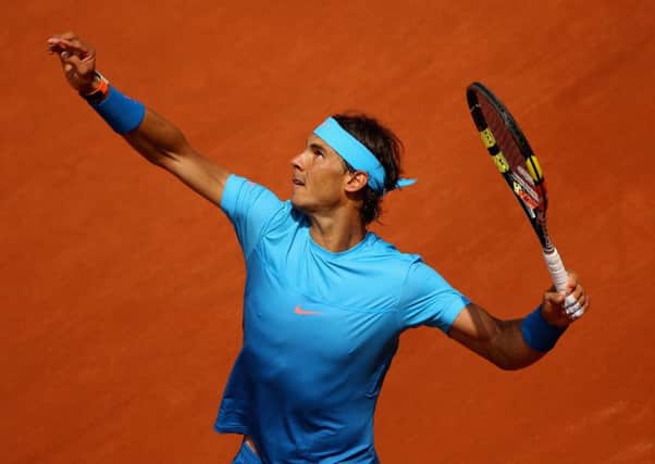 Defending champion Rafael Nadal serves during his straight-sets win over Quentin Halys. Picture: Getty
