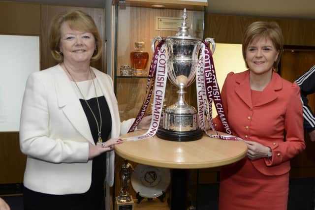 Nicola Sturgeon with Heart of Midlothian Football Club Chairwoman and Chief Executive Ann Budge, one of the first employers to sign the Scottish Business Pledge, a new partnership between Government and business to promote fairness and boost growth. Picture: PA