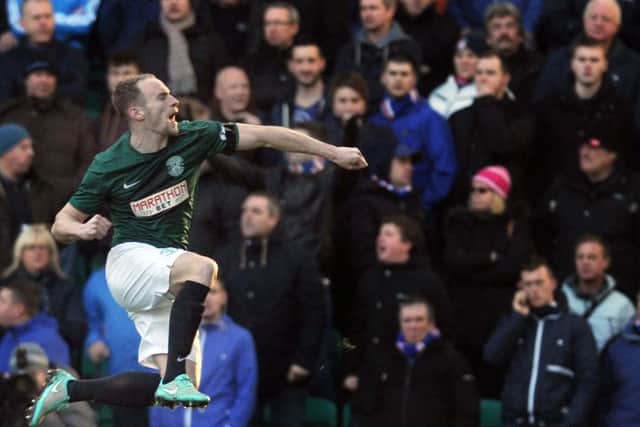 David Gray celebrates scoring for Hibernian against Rangers in December 2014. Picture: Neil Hanna